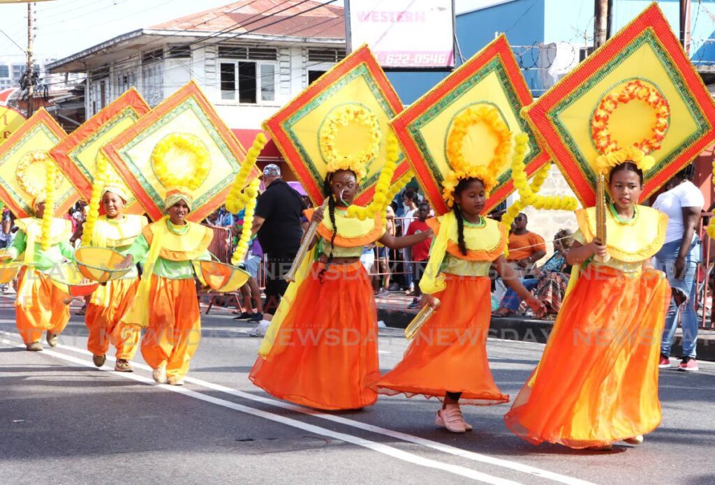 Masqueraders cross the stage with Spoilt Rotten Kids's portrayal Shaddi during the St James Children's Carnival parade Western Main Road, on February 4, 2024. - File photo by Ayanna Kinsale