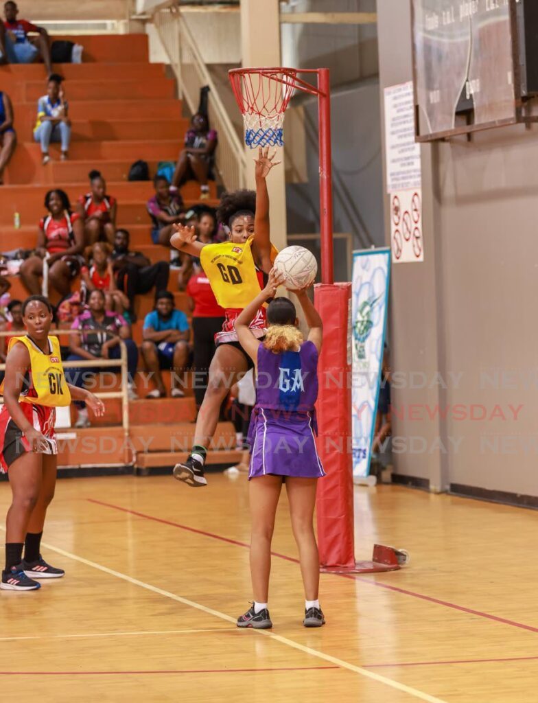 A UTT player defends against Police Netball Youth Club in the Fast5 netball tournament last year at the Eastern Regional Indoor Sports Arena, Tacarigua.  - File photo by Jeff K Mayers