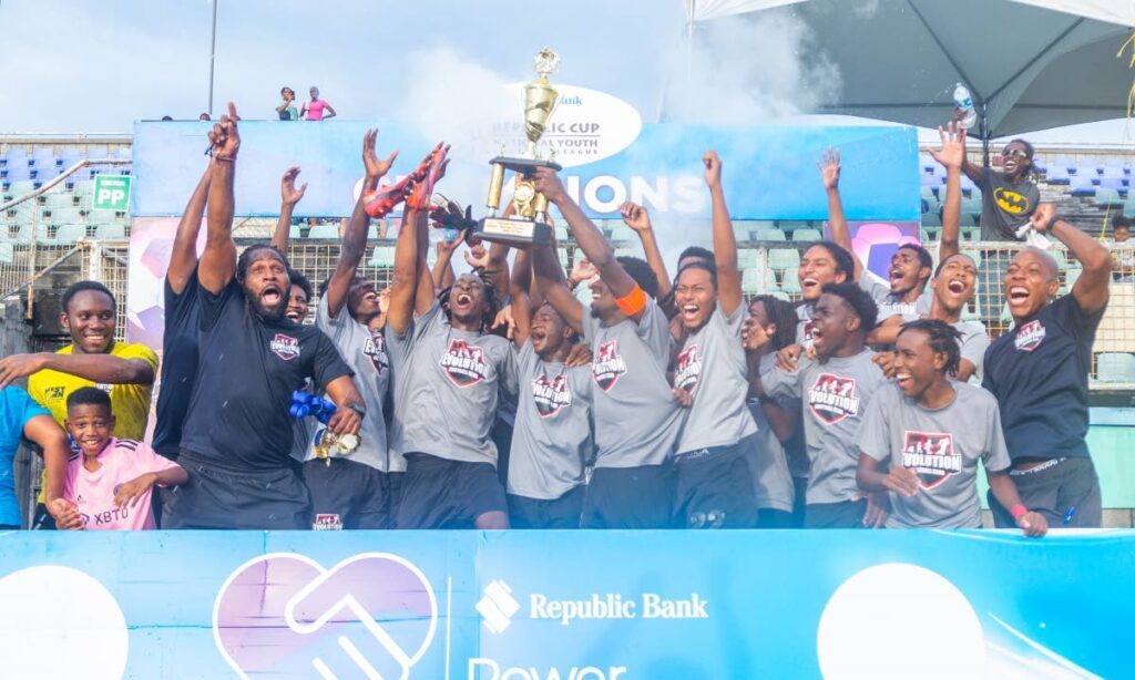 In this May 25, 2024 file photo, Evolution FC players and staff celebrate their victory in the under-20 age group of the Trinidad leg of the Republic Cup National Youth Football League at the Manny Ramjohn Stadium, Marabella. - Photo courtesy 12 Media Productions.  