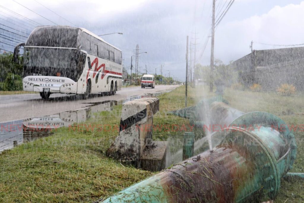 In this file photo, a leaking water main along the Priority Bus Route, in Beetham, Port of Spain. - Faith Ayoung