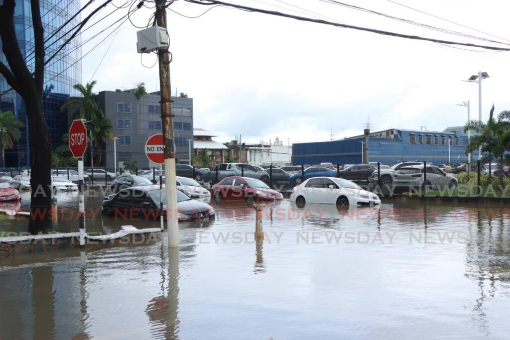 Cars are partially submerged during flooding in Port of Spain on August 15, 2024. Independent senator Anthony Vieira warns Port of Spain  could face catastrophic flooding within the next 25 years. - Photo by Angelo Marcelle