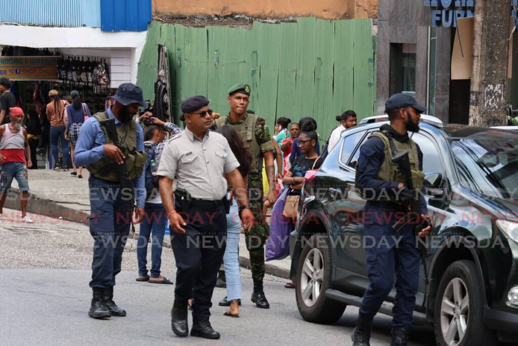 Officers on High Street, San Fernando, as part of a joint police-army patrol on October 11, 2024. - File photo