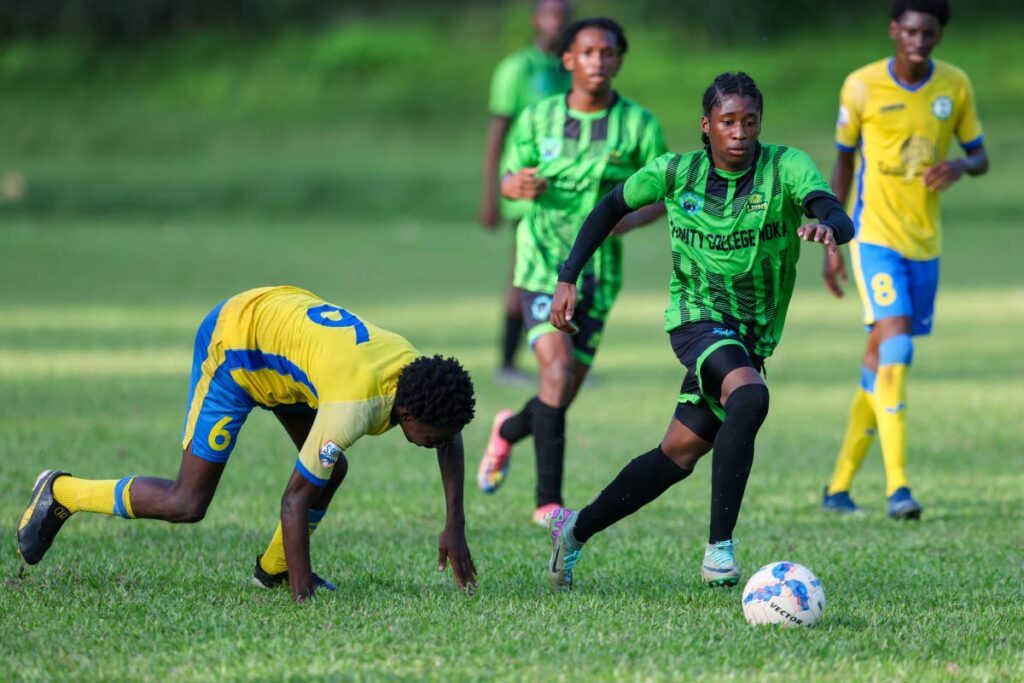 In this file photo,  Trinity College Moka Antonio Cole (R) dribbles past Carapichaima East Emmanuel Edwards (L) during the SSFL Championship Big 5 match at the Trinity College Moka grounds on October 24, 2024 in Moka. - Photo by Daniel Prentice 