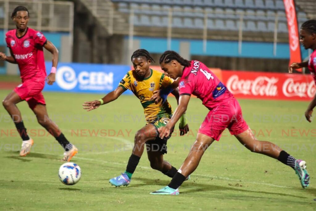 St Benedict's College striker Derrel Garcia, centre, in action against Naparima College during the Coca-Cola South zone Boys Intercol final at the Ato Boldon Stadium in Couva in November. - Photo by Ayanna Kinsale