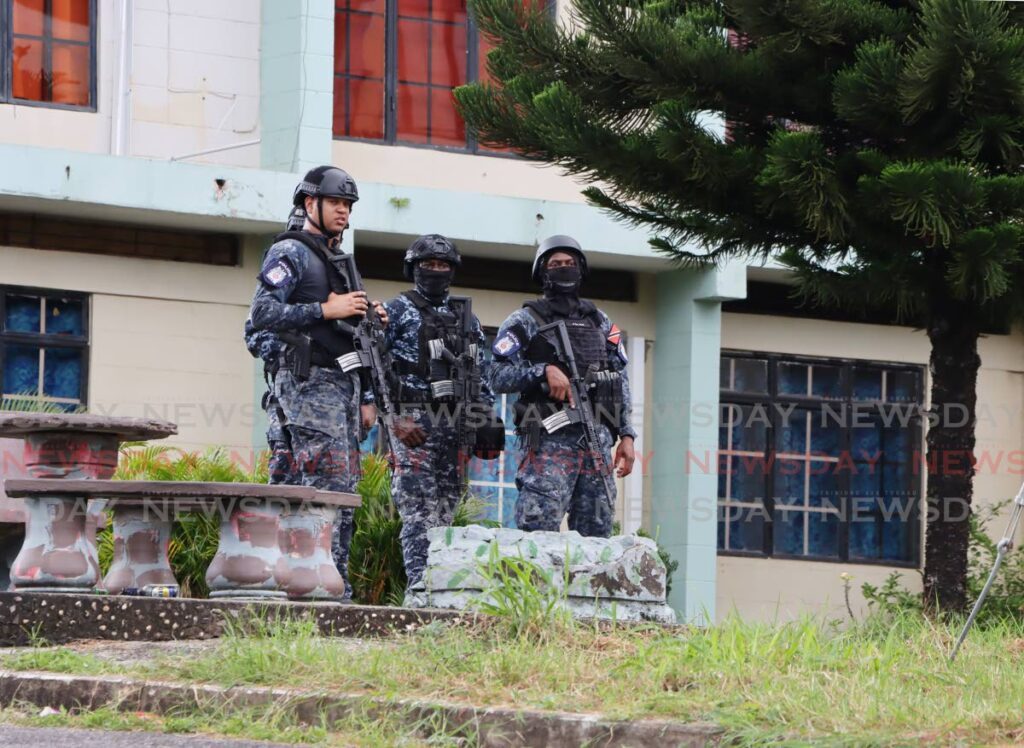 Police at Paradise Heights, Morvant after a man was gunned down on December 30, the same day the government announced the start of a state of emergency meant to curb gun violence in TT. 
- File photo by Ayanna Kinsale 