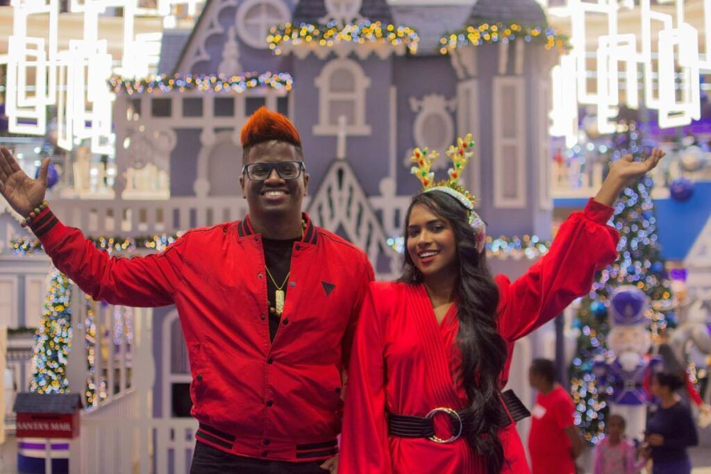  Performance duo DJ Ana and Ultra Simmo wave enthusiastically to their young fans as they make their grand entrance at Gulf City Mall. - 