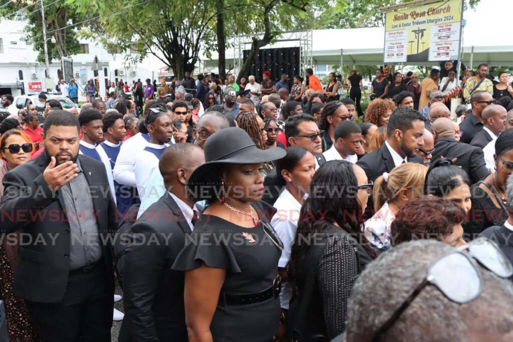 The large gathering of mourners outside the Santa Rosa RC Church in Arima for the funeral of D'Abadie/O'Meara MP Lisa Morris-Julian and her two children on January 2.  - Photo by Ayanna Kinsale