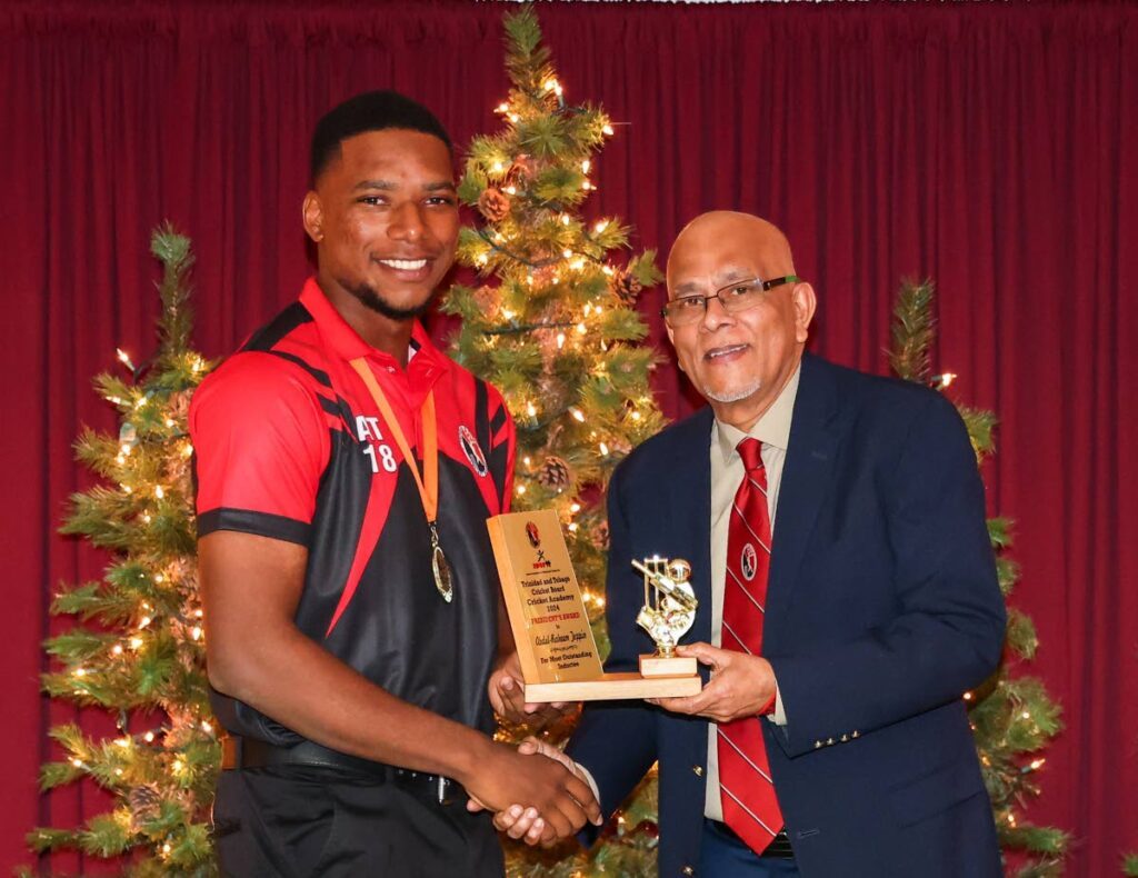 Abdul Raheem Toppin was named the most outstanding inductee at the TTCB/SporTT Academy to cop the President's Award from TTCB president Azim Bassarath. - 