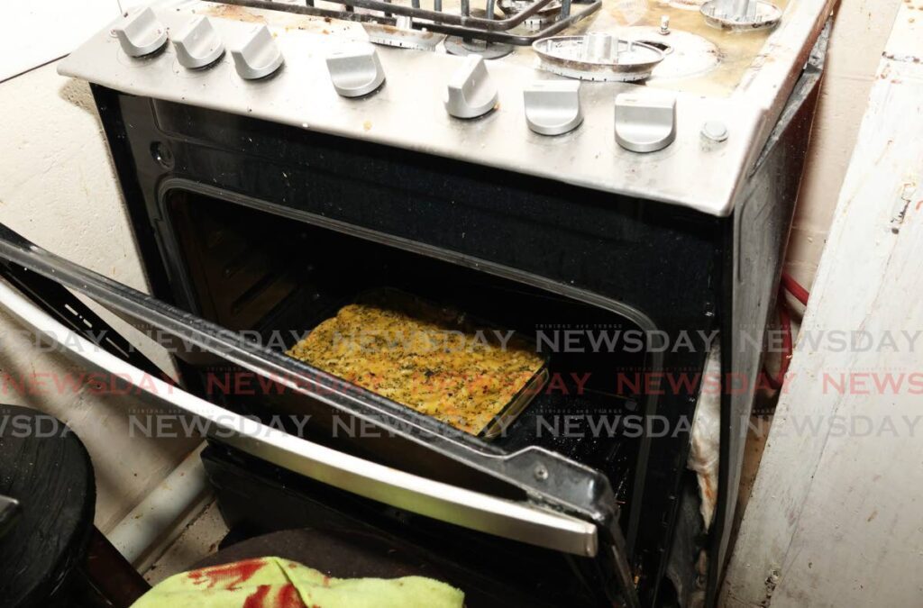 An unfinished macaroni pie was still in the oven after an explosion injured a worker at Saust Pot, New City Mall, Port of Spain on January 4. - Photos by Faith Ayoung