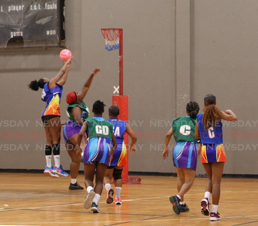 MIC Tigers (Metal Industries Company) and Defence Force compete at the Courts All Sectors Netball League opening knockout tournament at the Eastern Regional Indoor Sports Arena in Tacarigua on January 4, 2025. - Photo by Faith Ayoung