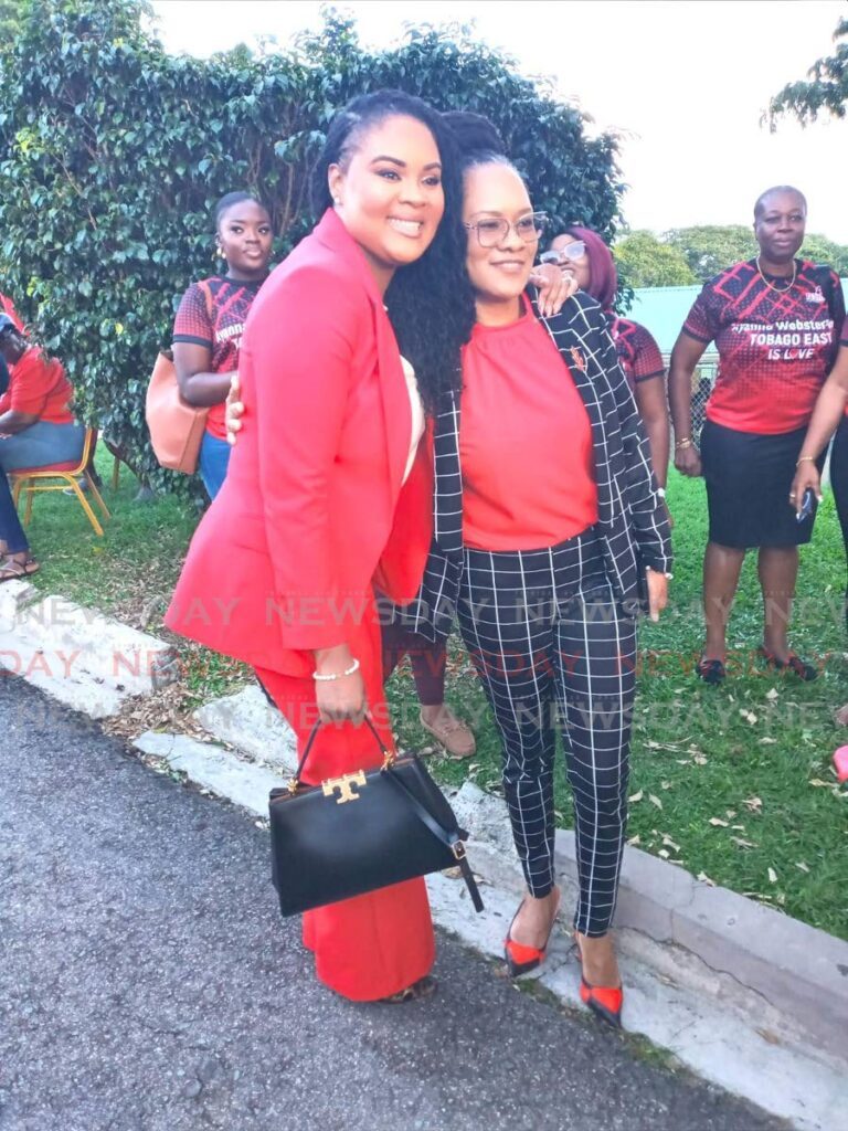 Members of Parliament Shamfa Cudjoe-Lewis, left, and Ayanna Webster Roy hug after they were re-selected to contest the Tobago West and Tobago East seats respectively in the upcoming general election. - Photo by Corey Connelly