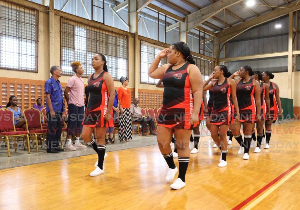 TT POST Warriors perform an eyes right during the march past of the teams at the Courts All Sectors Netball League opening ceremony at the Eastern Regional Indoor Sports Arena in Tacarigua on January 4. - Photo by Faith Ayoung