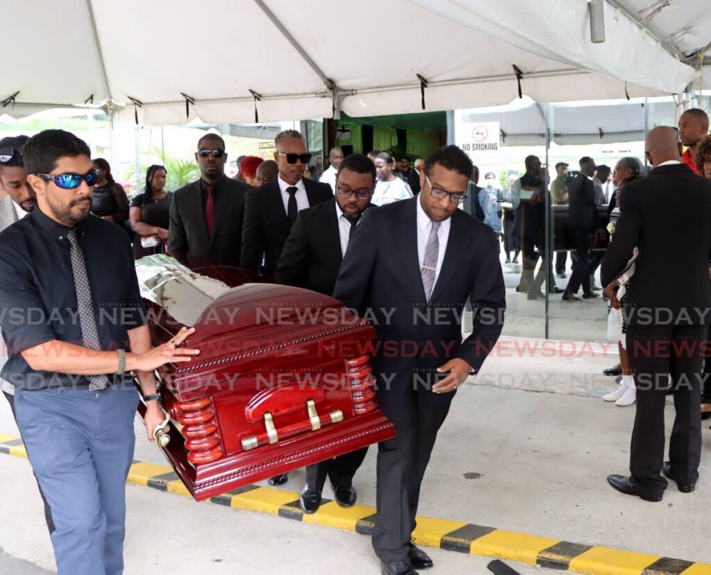 Pallbearers carry the body of special prosecutor Randall Hector at his funeral at the University of the Southern Caribbean in Maracas, St Joseph on January 9. - Photo by Ayanna Kinsale