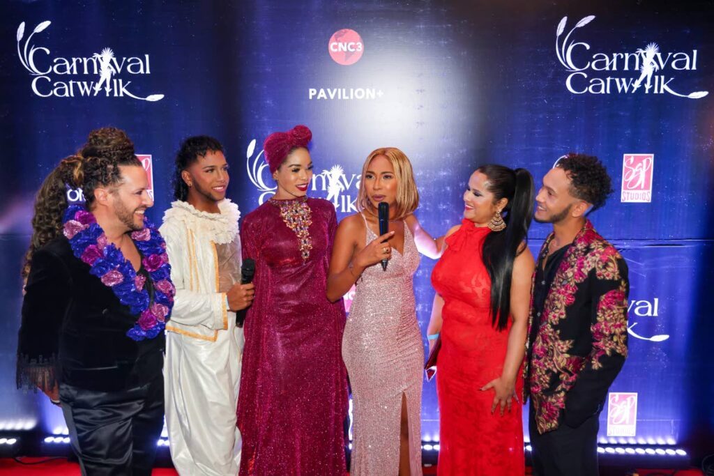 Carnival Catwalk contestants  Marco Stefano Pintus, left, Kristian Jaggesar, Naballah Chi, host Kandi King, Cee Boulaqui and Ryan Chan during Red Carpet Premiere of Carnival Catwalk. - Photos by Daniel Prentice