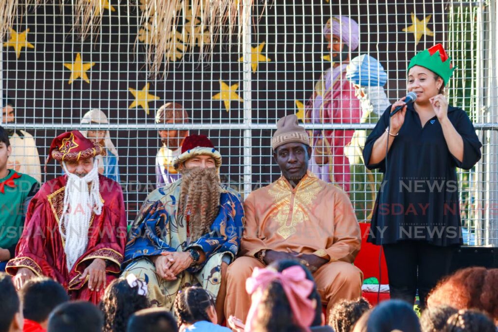 The Three Wise Men – Melchior, Gaspar and Baltasar – with La Casita director Andreina Briceño Ventura-Brown, at the Santa Rosa of Arima church park. - Photos by Grevic Alvarado 