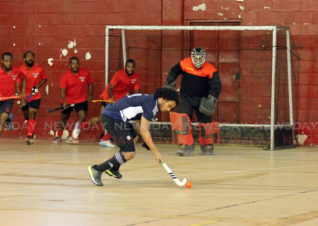 Aidan Elias of Queen's Park Cricket club (QPCC) gets in position to score against Paragon Hockey Club at the Ventures International Indoor Tournament 2025 at the Woodbrook Youth Facility,  Hamilton Holder Street, Port of Spain on Friday. - Faith Ayoung