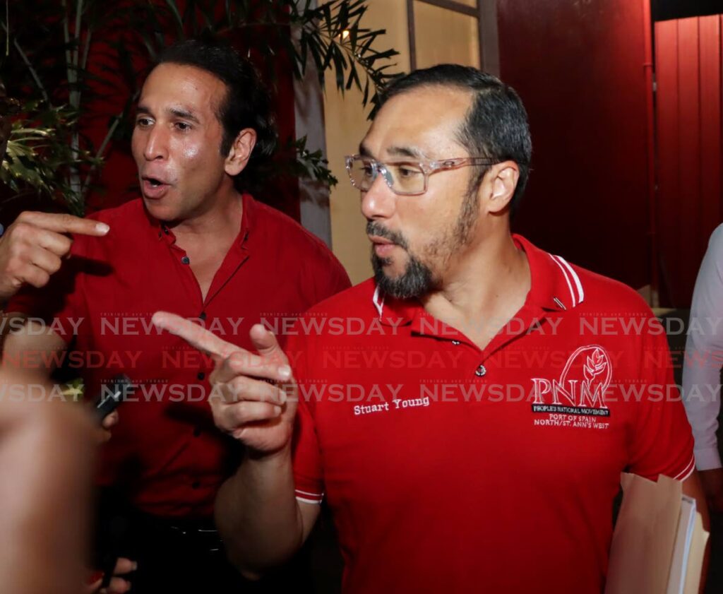 PNM chairman Stuart Young and party PRO Faris Al-Rawi speak to the media after the party's general council meeting at Balisier House, in Port of Spain on January 11. - Photos by Ayanna Kinsale