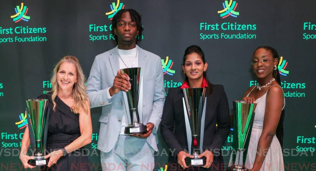 Sportswoman of the Year Karishma Ramharack (cricket), second from right, and Youth Sportsman of the Year Jelani Nedd (cycling), second from left, are flanked by Corina Wallace, left, mother of Youth Sportswoman of the Year Makaira Wallace (cycling) and Brittney Richards-Nelson, sister of Sportsman of the Year Jereem Richards (athletics), at the First Citizens Sports Foundation 2024 Sports Awards and Hall of Fame induction, at Hyatt Regency, Port of Spain on January 11.  - Photo by Daniel Prentice