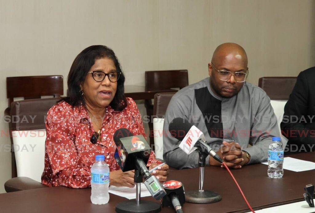 Minister of Trade and Industry Paula Gopee-Scoon and TT Manufacturing Association (TTMA) president Roger Roach speak to reporters at the Blue Waters Products Ltd manufacturing facility  on Orange Grove Road, Tacarigua, on January 13. - Photo by Faith Ayoung