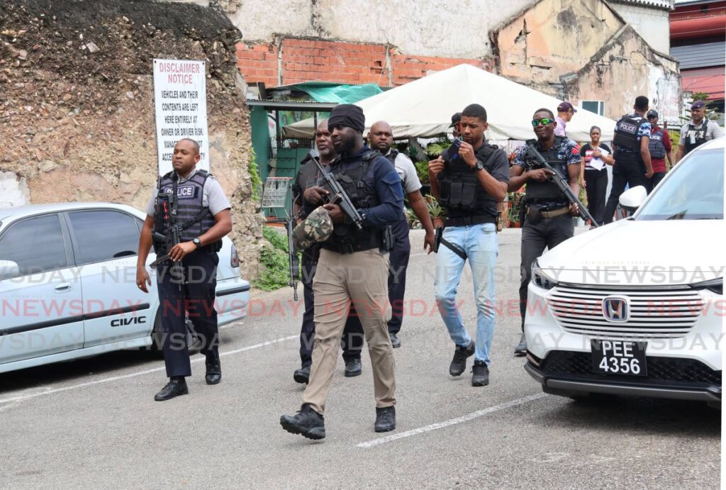 Police leaveThe People’s Mall on Frederick Street, Port of Spain on January 15, after conducting a search as part of ongoing state of emergency operations. - Photo by Faith Ayoung