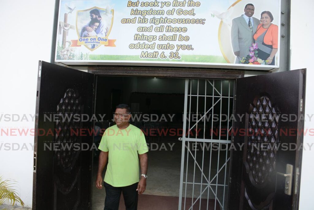 Pastor Kenrick Bowlah outside of the One on One Ministries at Calcutta Road #1 Mc Bean, Couva that was burglarised on January 16.  - Photo by Innis Francis