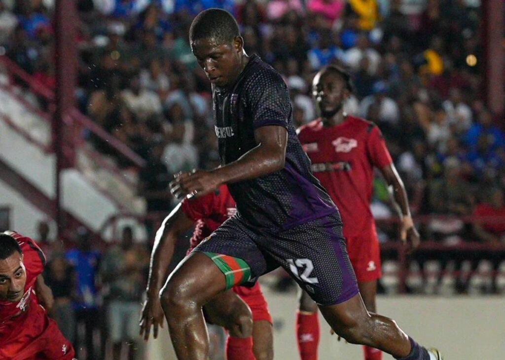 Isaiah Leacock of Defence Force takes a shot in a TT Premier Football League match against Central FC at La Horquetta Recreation Ground on January 17. - Photo courtesy TT Premier Football League Facebook Page 