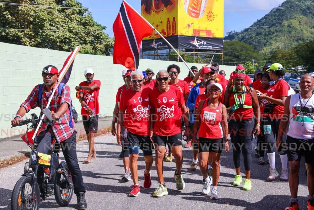 Newsday photographer Angelo Marcelle, left, shows his support for Brian Lewis and the other participants. - Photo by Daniel Prentice