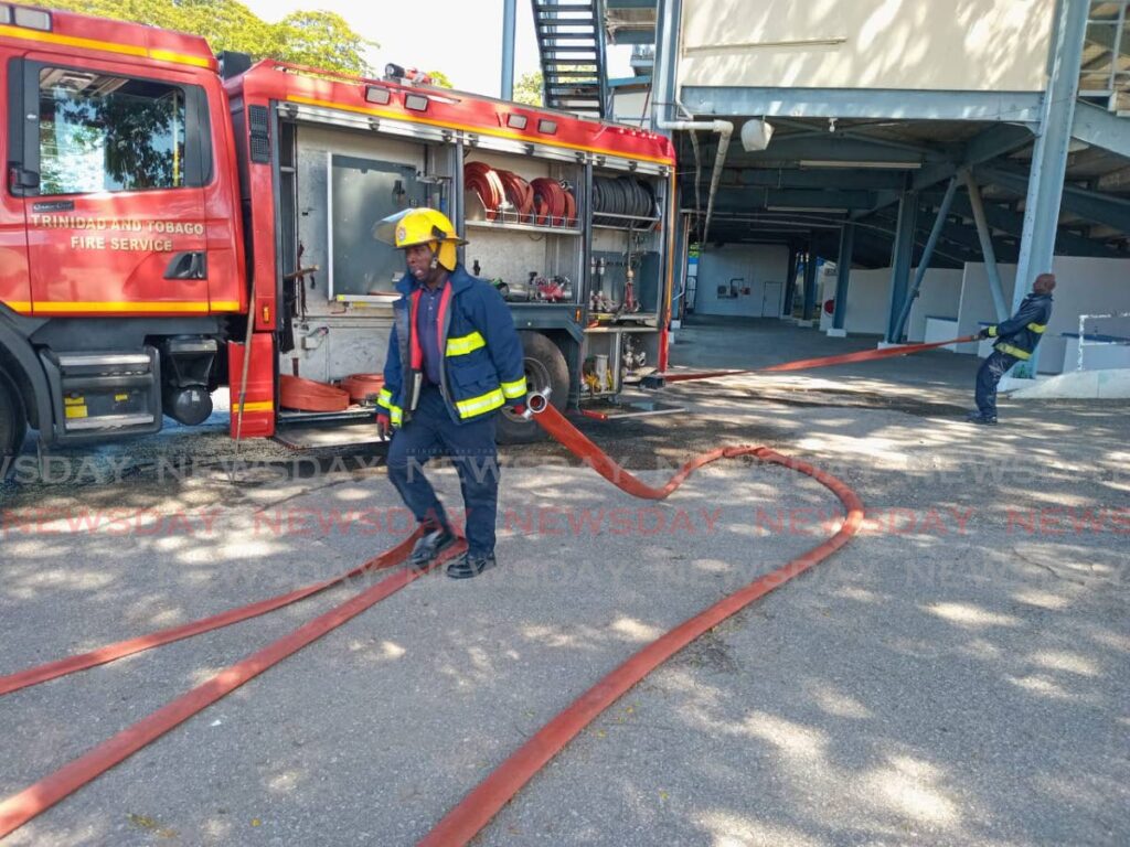 Fire officers respond to a blaze at the Queen's Park Oval on January 20.  - Photo by Jelani Beckles