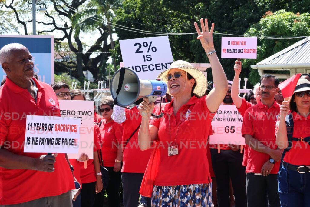 Donna Dyer, acting head of mathematics department, centre and members of the West Indies Group of University Teachers (WIGUT) union protest at UWI, St Augustine campus on January 20. - Photo by Faith Ayoung