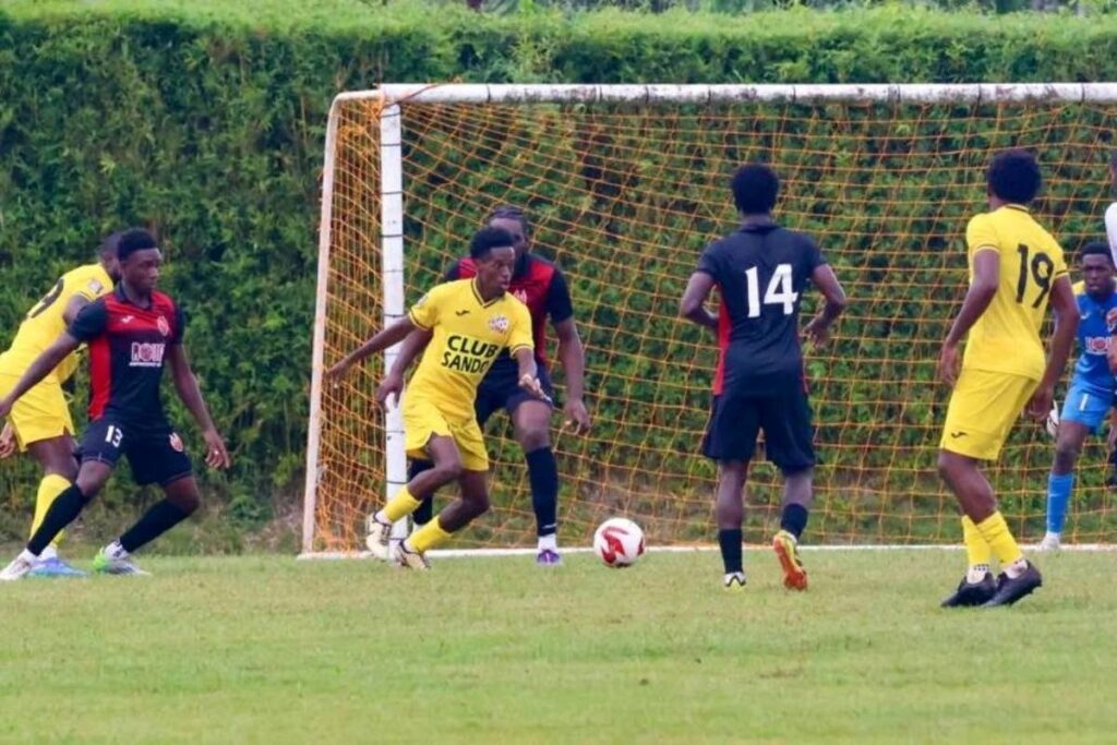 Club Sando’s Ezekiel Kesar (third from left) looks for a passing option against 1976 FC Phoenix in their TT Premier Football League clash at the Mahaica Sporting Complex in Point Fortin on January 19. - Photo courtesy TTPFL.   