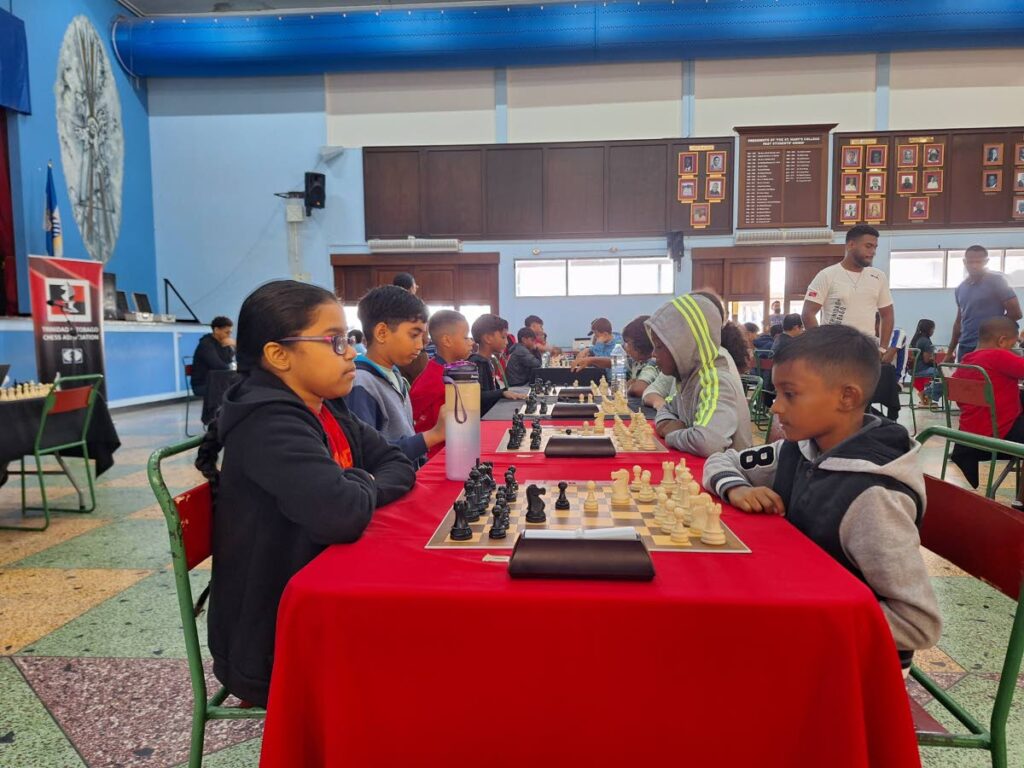 Locked in: Chess Players showcase their skills at the Kenneth Fitzpatrick Memorial Junior Chess Tournament at the Centenary Hall of St Mary's College, Port of Spain on January 11.  - 