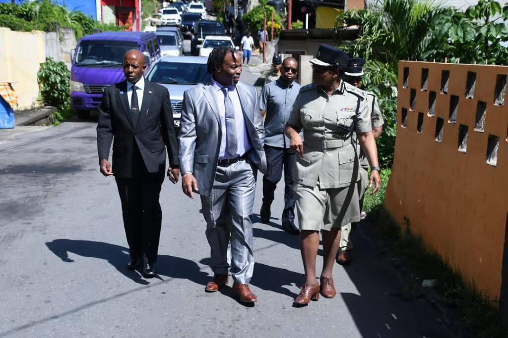 Commissioner of Police Erla Harewood-Christopher and Minister in the Ministry of National Security Keith Scotland, walk about in Carenage as they greet residents on January 24.  - Photo courtesy TTPS Facebook 