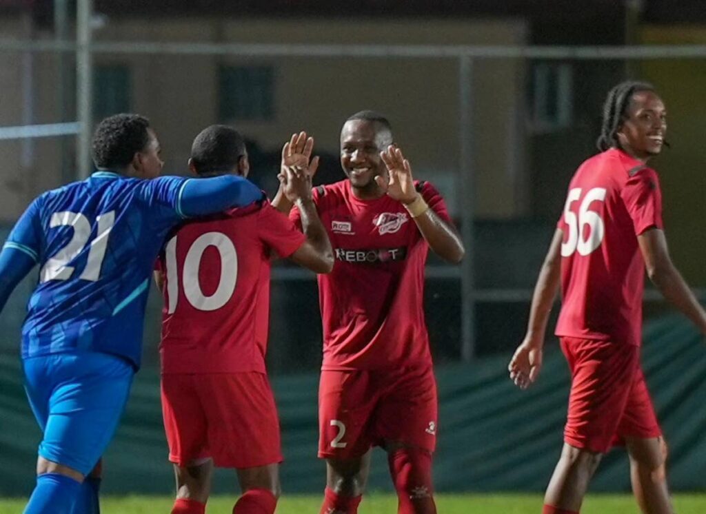 Central FC Reboot’s John Paul Rochford (2L) celebrates with teammates after scoring against Point Fortin Civic, on January 24, 2024, at the La Horquetta Recreation Grounds, La Horquetta.  - Photo via TTPFL