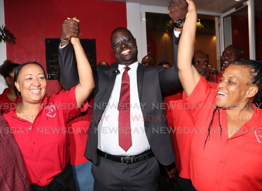 Dominic Romain, centre, celebrates with supporters after being selected as the PNM's candidate for the Malabar/Mausica constituency on Monday evening at Balisier House, Port of Spain. - Photo by Angelo Marcelle