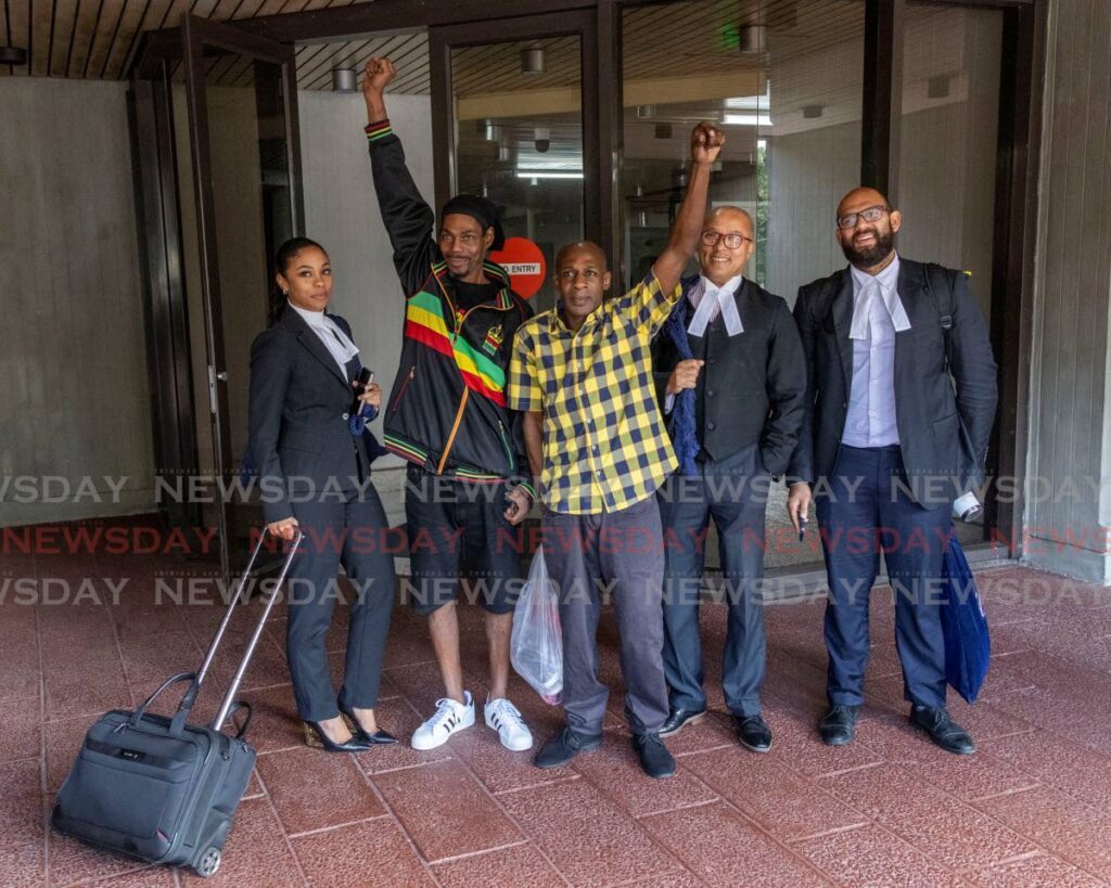 FREEDOM: McDonald Bailey, second from left, and Keon Anthony, with their attorneys Chelsea John, Larry Williams, and Adam Roberts at the Hall of Justice, Port of Spain.  - Photo by Jeff K Mayers