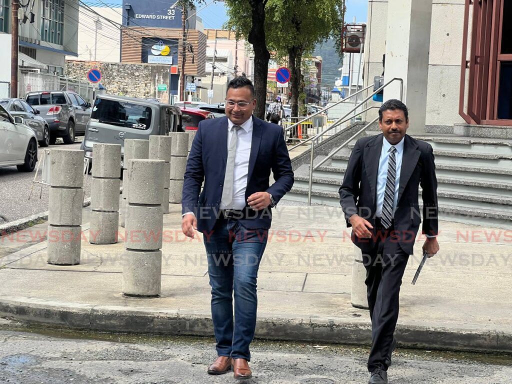 ERLA’S TEAM: Attorneys Terry Boyer, left, and Robert Doodnath, who represent CoP Erla Harewood-Christopher, leave Police Administration Building, Port of Spain.  - Photo by Enrique Rupert