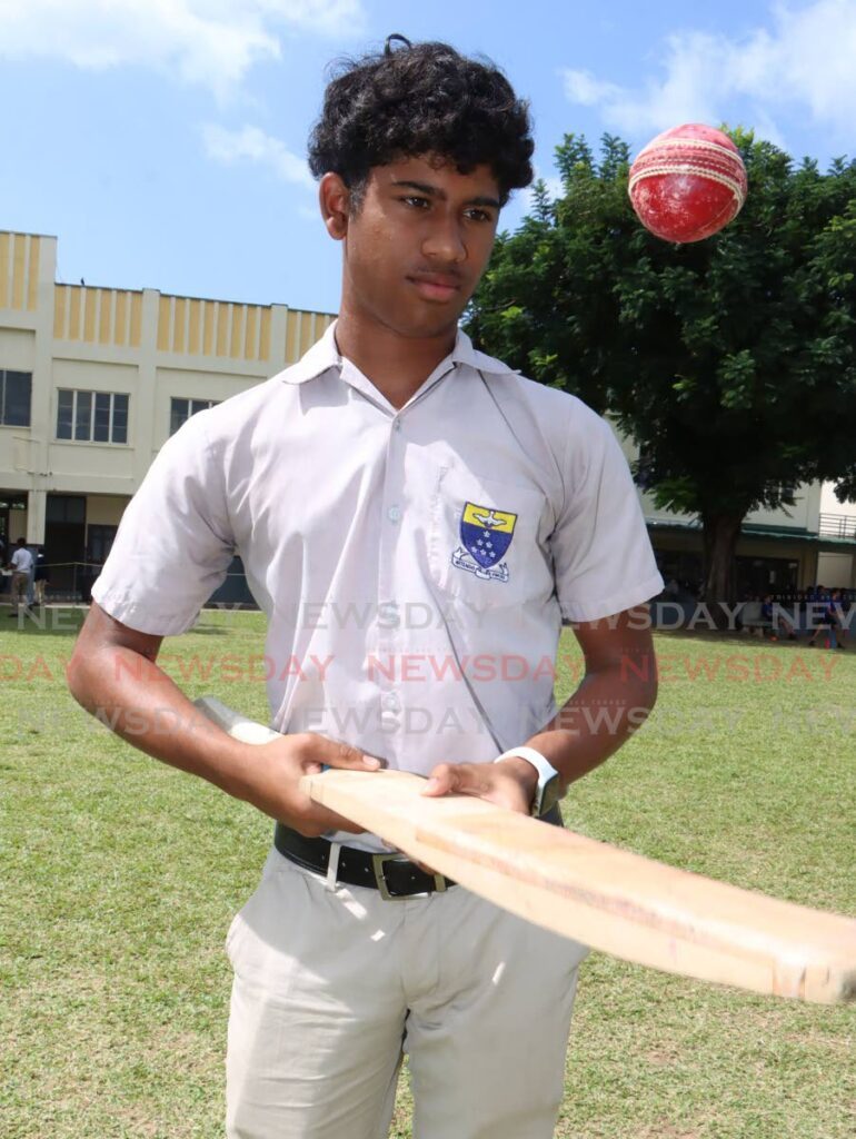 Cricketer  Maleek Lewis of Fatima College, looks up to Brian Lara. - Photo by Angelo Marcelle