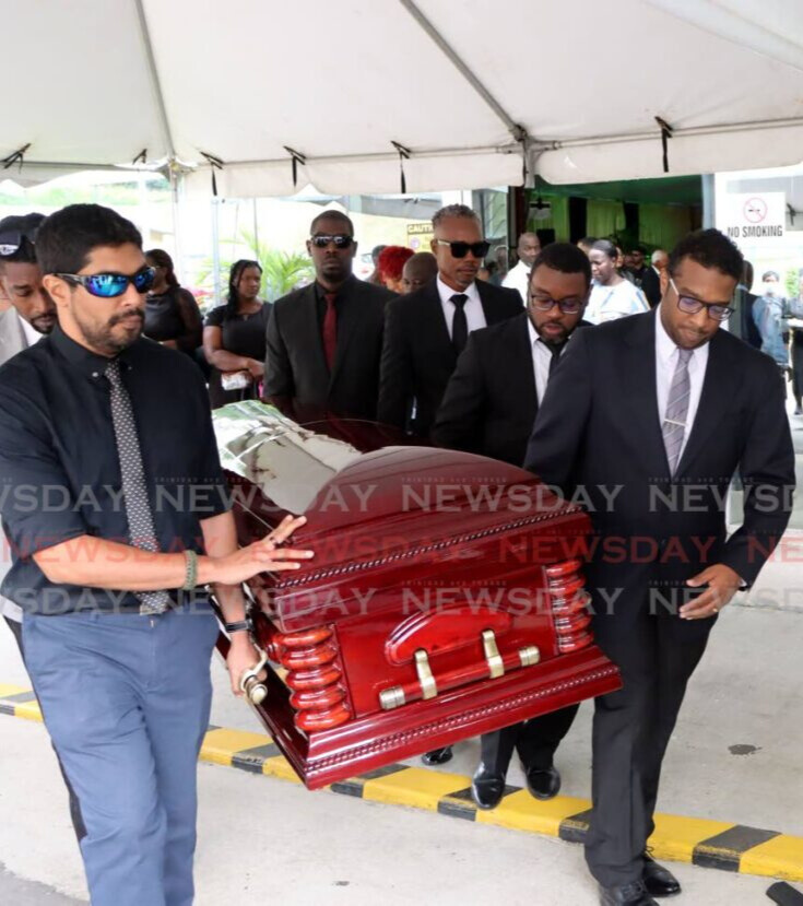 Pallbearers carry the body of attorney Randall Hector at his funeral at the University of the Southern Caribbean, Maracas, St Joseph, on January 9. - Photo by Ayanna Kinsale