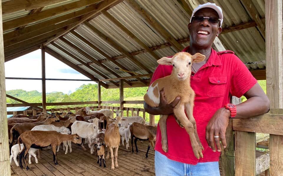 Prime Minister Dr Keith Rowley holds a lamb on his farm in Tobago in 2020. - Photo courtesy Facebook