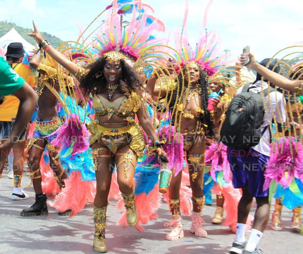 A masquerader from Yuma's Awakened Treasure, 24K enjoys herself while crossing the stage at the Queen's Park Savannah, Port of Spain on Carnival Tuesday in 2023.  - File photo by Ayanna Kinsale