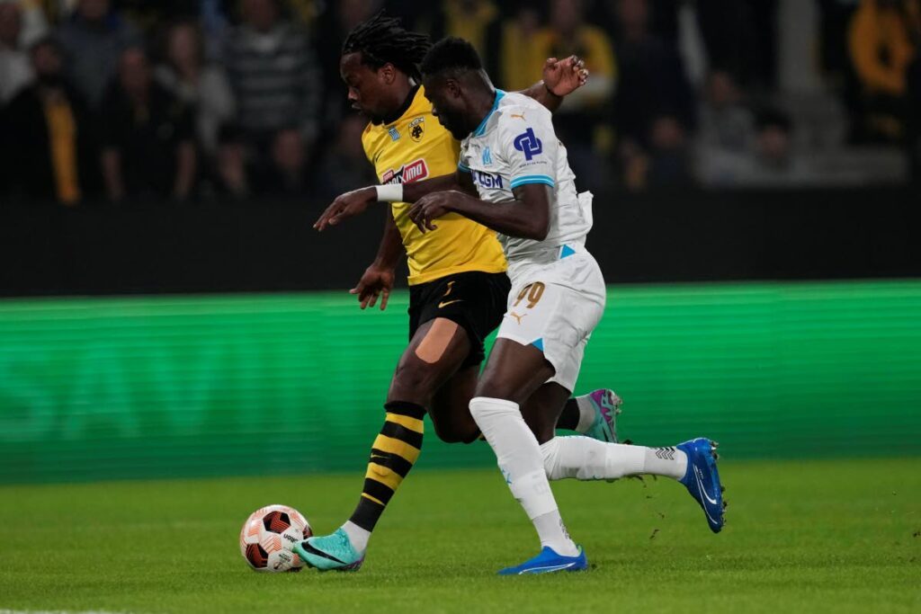 In this November 9, 2023 file photo, Marseille's Chancel Mbemba (R) tries to stop AEK's Trinidad and Tobago forward Levi Garcia during the Europa League Group B match at the OPAP Arena in Athens, Greece. - AP Photo