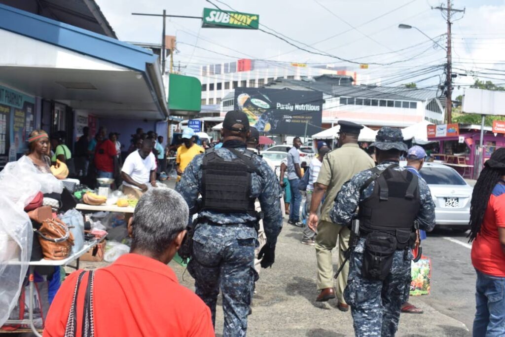 Police officers patrol one of the shopping districts in Tobago.  - Photo courtesy TTPS