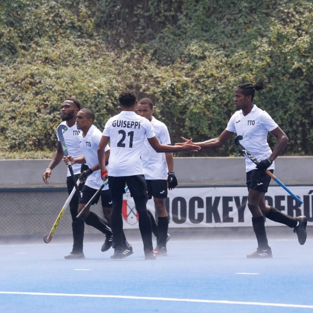 TT men's hockey player Teague Marcano, right is congratulated by teammate Caleb Guiseppi during their Pan American Challenge win over Peru at the Andres Avelino Caceres Sports Complex, Lima, Peru on September 10, 2024. Photo courtesy Pan American Hockey Federation - 