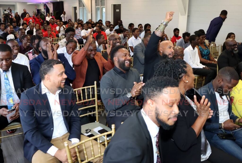 HAPPY: Participants interact during the launch of the MpowerTT initiative on Friday at the Hasely Crawford Stadium. PHOTO  BY AYANNA KINSALE - Ayanna Kinsale