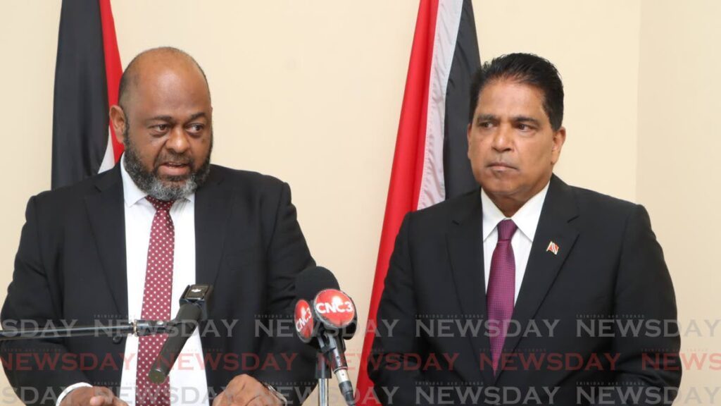 Attorney and UNC Toco/Sangre Grande candidate Wayne Sturge, left, makes a point at a press conference on January 31 at the Office of the Opposition Leader in Port of Spain. At right is Oropouche East MP Dr Roodal Moonilal. - Photo by Angelo Marcelle