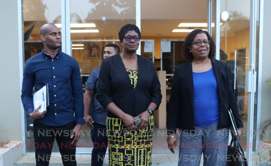 Commissioner of Police Erla Harewood-Christopher, is flanked by her attorneys Pamela Elder, SC, right and Russell Warner, after she was released from custody at the St Clair Police Station on February 1. - Photo by Angelo Marcelle