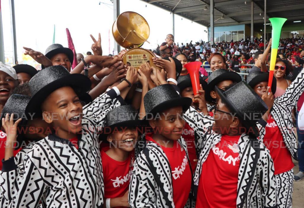 Members of the San Fernando Boys' RC School steelband celebrate after placing first in the Junior Panorama finals primary school category at the Queen's Park Savannah, Port of Spain, on February 2. 