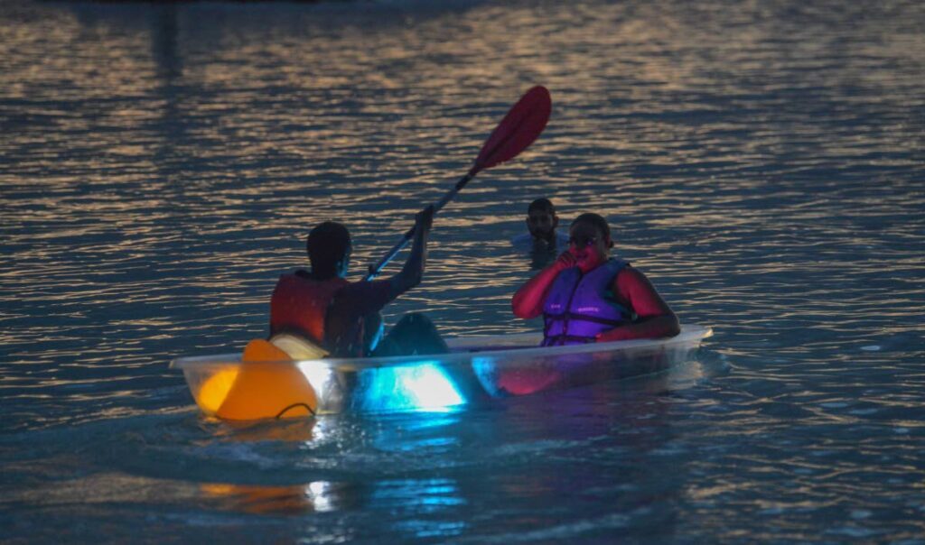 Newsday reporter Janelle De Souza, right, enjoys a kayak ride at Swallows Beach. - Visual Styles