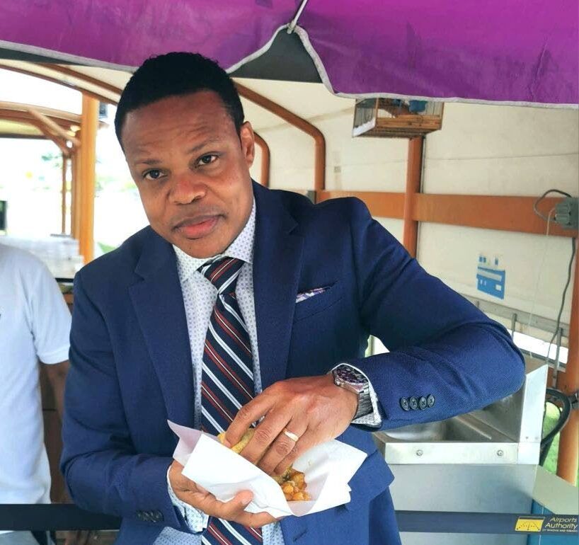 I EAT DOUBLES: Foreign and Caricom Affairs Minister Dr Amery Browne about to eat some doubles in this photo posted to his Facebook page on Tuesday.  - FB