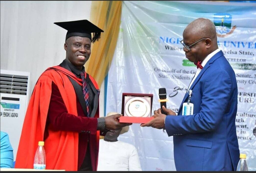 Prof Mark Wuddivira, dean of the Faculty of Food and Agriculture at UWI St Augustine, left, receives a plaque of honour from Niger Delta University vice chancellor Prof Allen A Agih last December. - Photo courtesy UWI